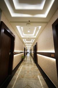 a hallway in a building with a ceiling at hotel the lilli villas in Alambagh