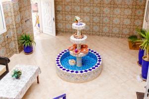 a living room with a table with a duck on it at The Rina Hostel in Agadir