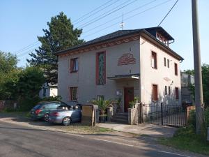 a house with a car parked in front of it at Apartmán U Zebry in Bílá Třemešná