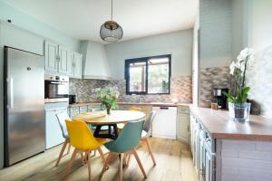 Kuchyň nebo kuchyňský kout v ubytování Maison et Jardin - Chambre Cosy