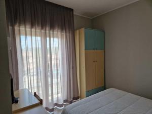 Postel nebo postele na pokoji v ubytování Hotel Dogana