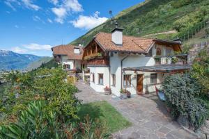 a house with a view of a mountain at Steidlerhof in Bolzano