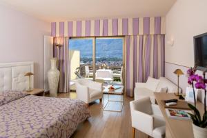 Rúm í herbergi á Hotel Ascona