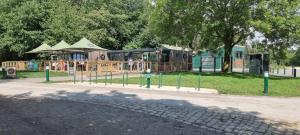 a playground with a train in a park at The Pennington Apartment & FREE Parking Next to Sports Village in Leigh