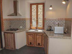 A kitchen or kitchenette at Apartment in Casola near Torre di Casola