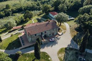 an aerial view of a large house with a driveway at VIN Hotel - La Meridiana Montieri in Montieri