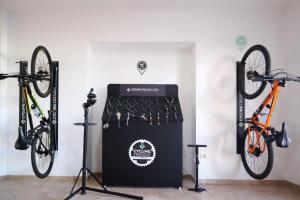 a bike rack with two bikes in a room at Chatur Playa Real Resort in Adeje