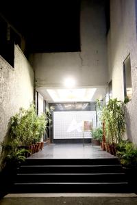 a hallway with a large screen in a building at HOTEL BLUE PEARL in Bhopal