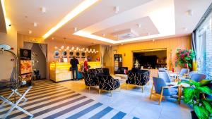 a lobby of a restaurant with tables and chairs at Old Town Point Hotel & Spa Antalya in Antalya