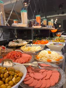 a buffet with many different types of food on display at Old Town Point Hotel & Spa Antalya in Antalya