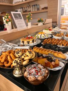 a buffet filled with lots of different types of pastries at Old Town Point Hotel & Spa Antalya in Antalya