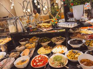 a buffet filled with lots of different types of food at Old Town Point Hotel & Spa Antalya in Antalya