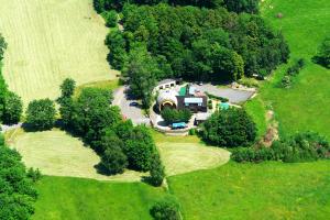 an overhead view of a large house in a field at Obří Sud Libverda *** in Lázně Libverda