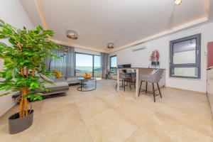 a living room with a couch and a table at Apartman Seaside 5 in Banjole