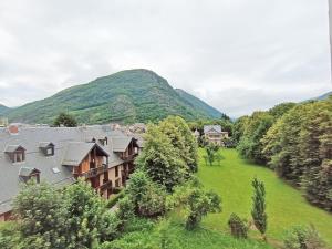 an aerial view of a village with a mountain at Chez Charlotte, T3 duplex, vue montagne, parking gratuit, 4 personnes in Luchon