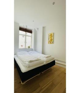 Säng eller sängar i ett rum på ApartmentInCopenhagen Apartment 1556