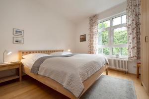 Voodi või voodid majutusasutuse Villa am Hang Wohnung 11 toas