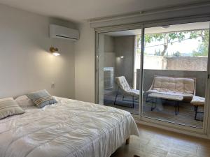 Postel nebo postele na pokoji v ubytování T3 bis bord du canal du midi piscine + 14 fotografií