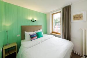 Letto o letti in una camera di Hôtel de l'Ange
