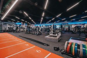 a gym with cardio equipment and a race track at Wrightington Hotel & Health Club in Wigan