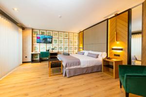 Cama ou camas em um quarto em Hotel Antonio II