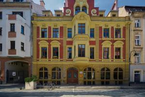 a large yellow building with a lot of windows at 350m to the Market Square - Św Antoniego Apartment by Renters in Wrocław