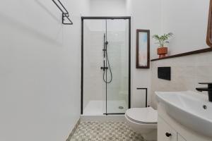 a bathroom with a shower and a toilet and a sink at 350m to the Market Square - Św Antoniego Apartment by Renters in Wrocław