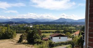 a view of a mountain range from a building at Pyrenees Vue Gite - Vues Fantastique, Parking Gratuit Sur Place & Piscine in Saint-Gaudens