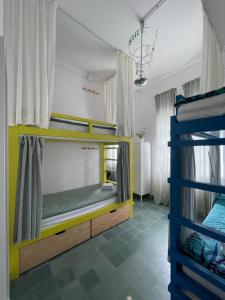 Postel nebo postele na pokoji v ubytování Hostal Bubango