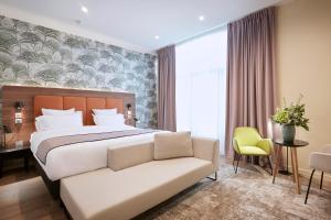 Postel nebo postele na pokoji v ubytování Quality Hotel Bordeaux Centre
