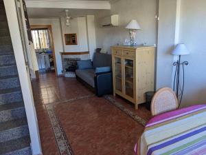 a living room with a couch and a bed in it at House in Orihuela. Sea view. in Orihuela +22 photos