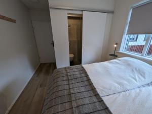 Postel nebo postele na pokoji v ubytování The Ísafjörður Inn by Ourhotels