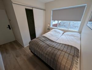 Postel nebo postele na pokoji v ubytování The Ísafjörður Inn by Ourhotels