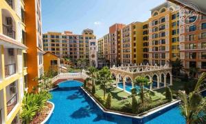 an aerial view of a resort with a pool and buildings at Venetiean Condo Pattaya by LJB719 in Jomtien Beach
