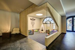 a childrens room with a play area with a window at Chamonix Praz Vue Mt Blanc Piscine in Chamonix-Mont-Blanc