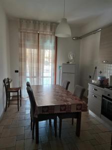 a dining room table and chairs in a kitchen at Appartamento Scarperia San Piero a Sieve in San Piero a Sieve