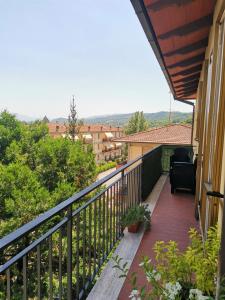 a balcony of a house with a black railing at Appartamento Scarperia San Piero a Sieve in San Piero a Sieve