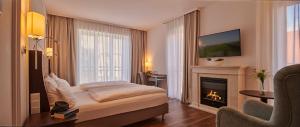 TV a/nebo společenská místnost v ubytování Hotel am Delft