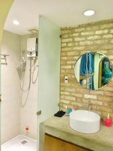 a bathroom with a sink and a mirror at VY DA CENTRAL MARKET HOSTEL in Ho Chi Minh City