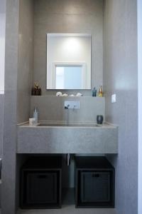 a bathroom with a sink and a mirror at Casetta al mare in Barletta +47 photos