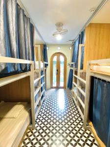 a train room with bunk beds and a hallway at VY DA CENTRAL MARKET HOSTEL in Ho Chi Minh City +29 photos