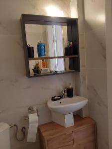 a bathroom with a sink and a mirror at Amor de Skioni in Nea Skioni +16 photos