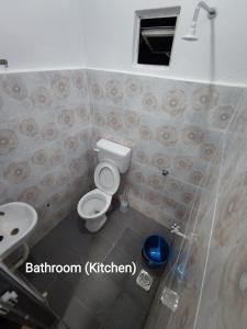 a bathroom with a toilet and a sink at 4A Home2Stay in Kota Bharu