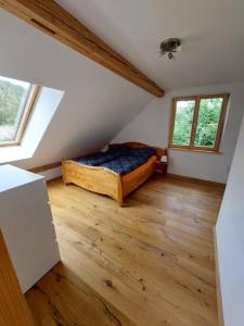 a bedroom with a bed in a attic at Zum Eichbühl in St. Blasien