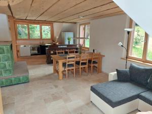 a living room with a table and a couch at Zum Eichbühl in St. Blasien