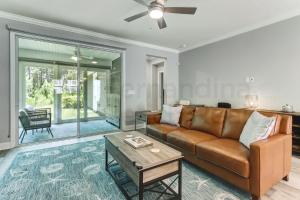 a living room with a couch and a table at 632 Palmetto Place - Wildlight home in Yulee