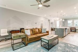 a living room with a couch and a kitchen at 632 Palmetto Place - Wildlight home in Yulee