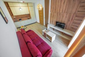 TV a/nebo společenská místnost v ubytování Pini Apart-hotel
