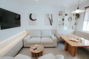 a living room with a couch and a table at Apartment Datala in Marina