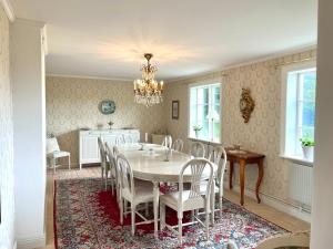 a dining room with a table and chairs at Engsholms Slott - Adults Only in Mörkö